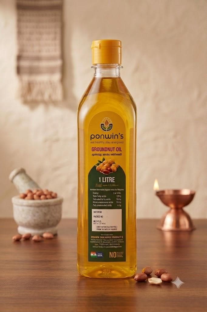 Groundnuts in a stone mortar beside a bottle of Ponwin's groundnut oil